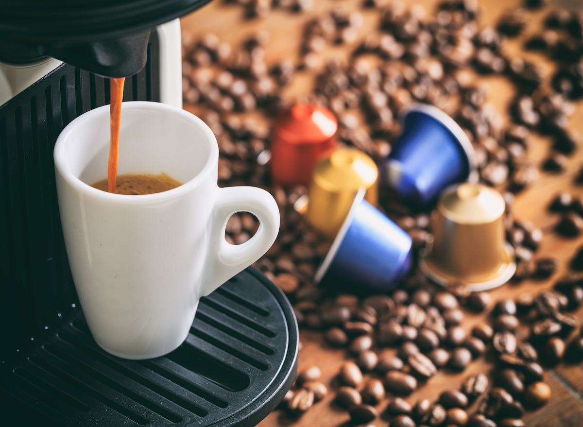 Espresso,Coffee,Capsules,And,Machine,Maker,On,A,Wooden,Table,