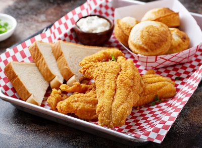 Fried catfish with cornbread dipped with buttermilk and seasoned with cornmeal, southern tradition