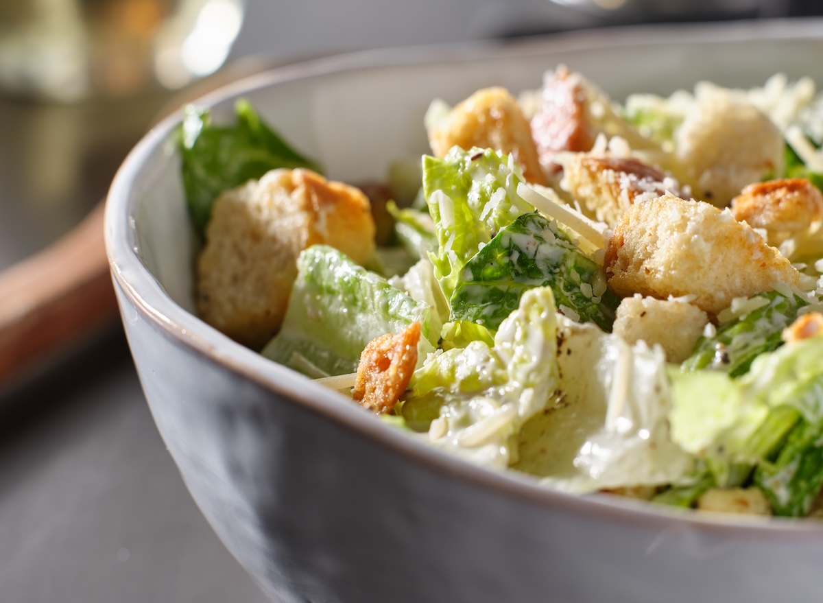 Fresh,Caesar,Salad,With,Croutons,And,Parmasan,Cheese,In,Bowl