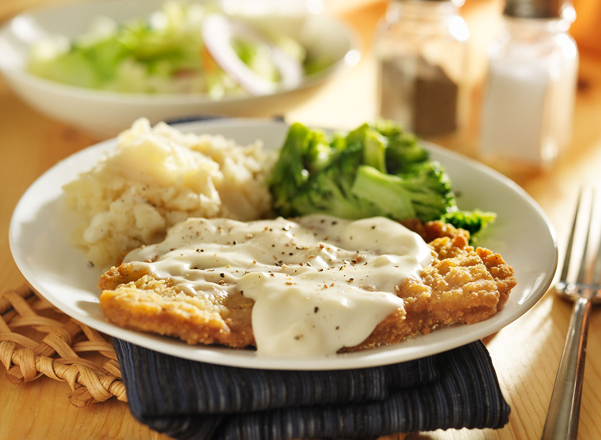 country fried steak with southern style peppered milk gravy