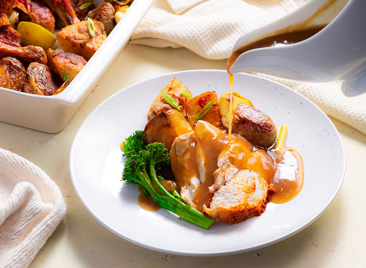 Roast Chicken served with Veg and Gravy being poured