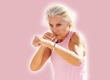 Mature woman doing sport in a coastal port. Arm training throwing boxing punches. Female doing shadow boxing outdoors. 5 Standing Exercises That Tighten Arm Jiggle in 21 Days After 50. Cover
