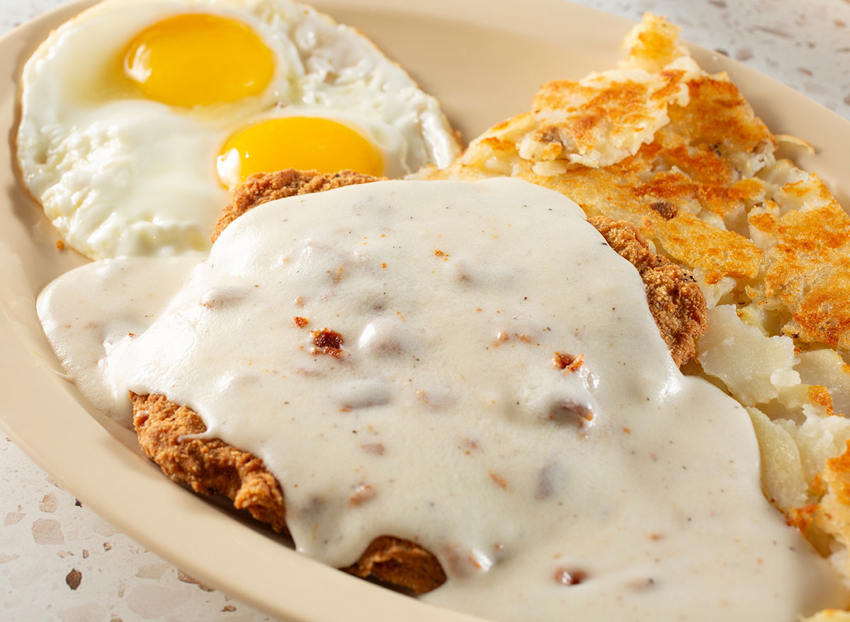 A closeup view of a country-fried steak entree.