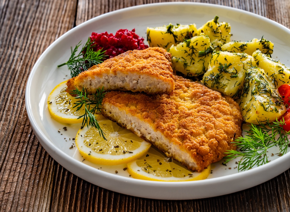 Breaded,Fried,Pork,Chop,With,Boiled,Potatoes,And,Beets,On