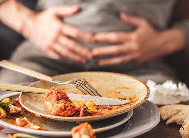 Woman feeling full after eating
