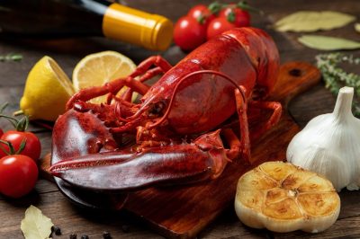 Steam lobster and wood grain background