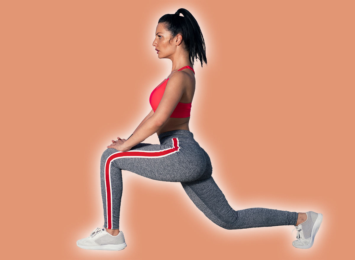 Female fitness athlete stretching her legs on the bridge