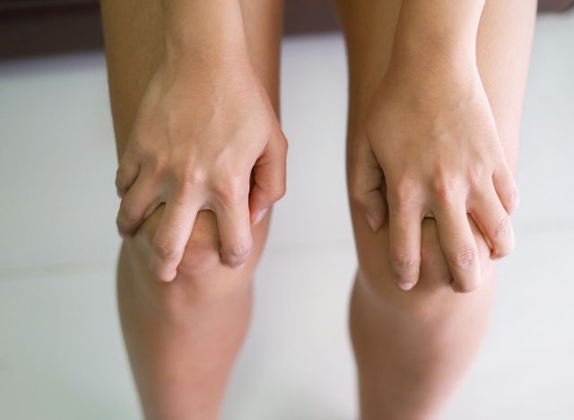 She is massage her knees from long standing.