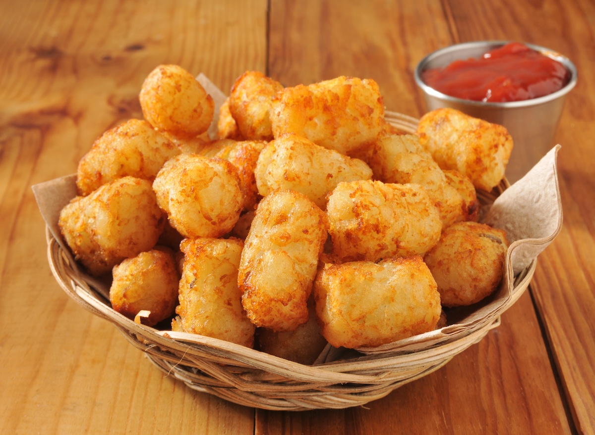 A,Basket,Of,Tater,Tots,On,A,Rustic,Wooden,Counter