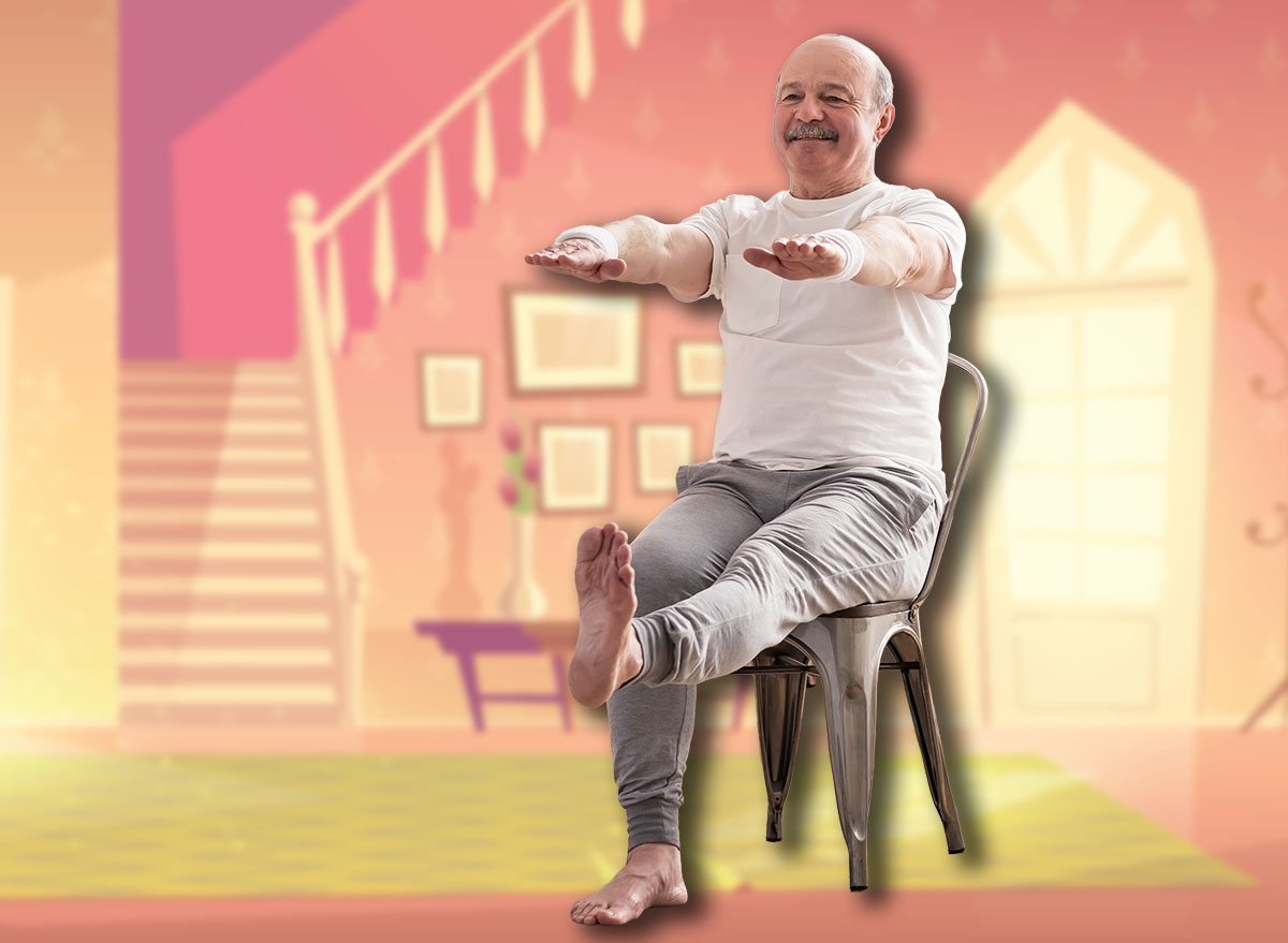 Elderly man practicing yoga asana or sport exercise for legs and hands on chair