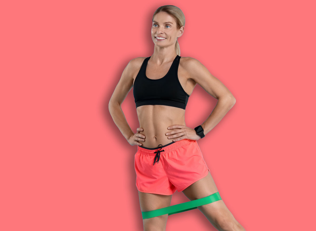Woman exercising with elastic resistance band on light blue background. Space for text