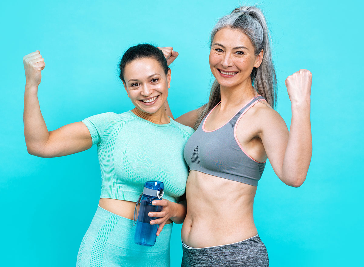 Image of two women with different body, age, and ethnicity making sport. Female models wearing sport outfits having fun at the gym. Concept about body positivity, self acceptance and lifestyle