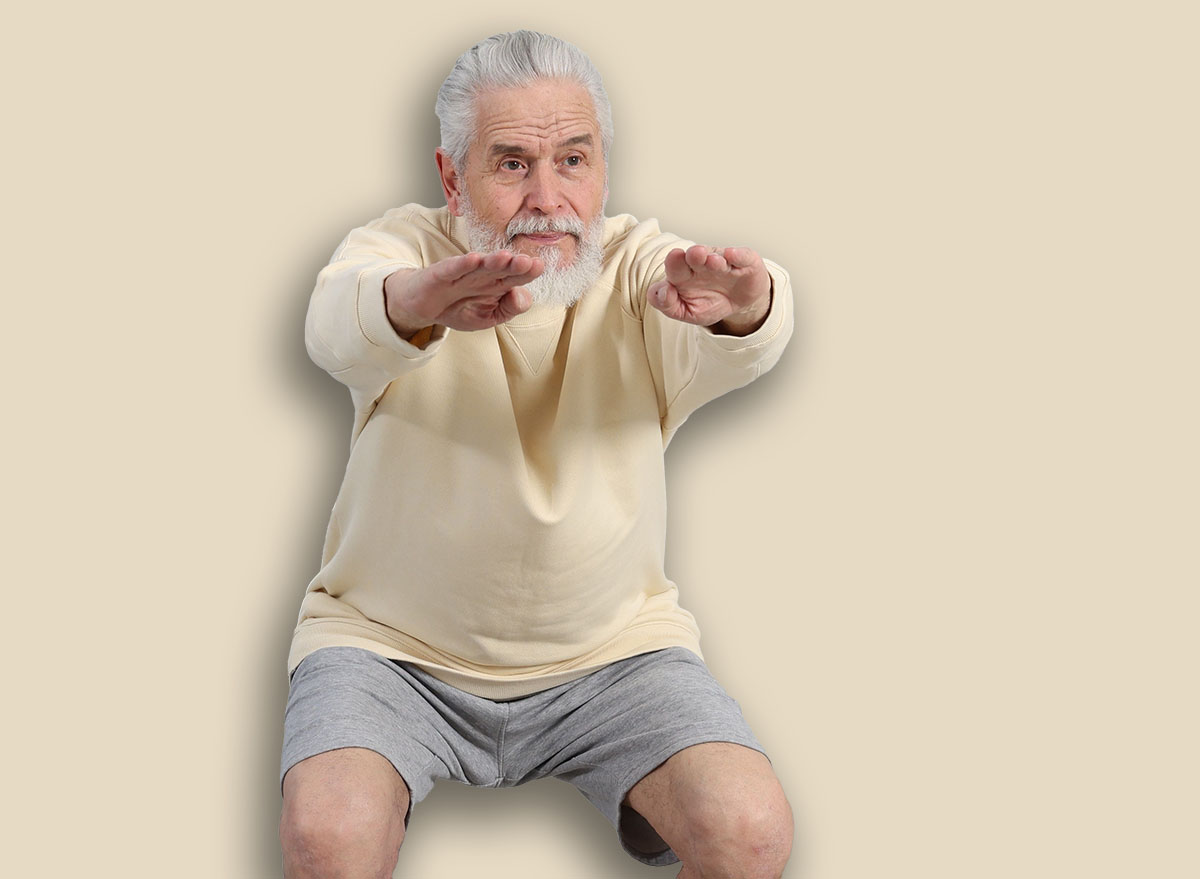 Elderly man exercising at home. Healthy leisure