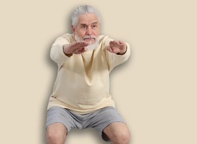 Elderly man exercising at home. Healthy leisure