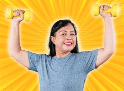 Happy Senior Woman Doing a Shoulder Press with Dumbbells