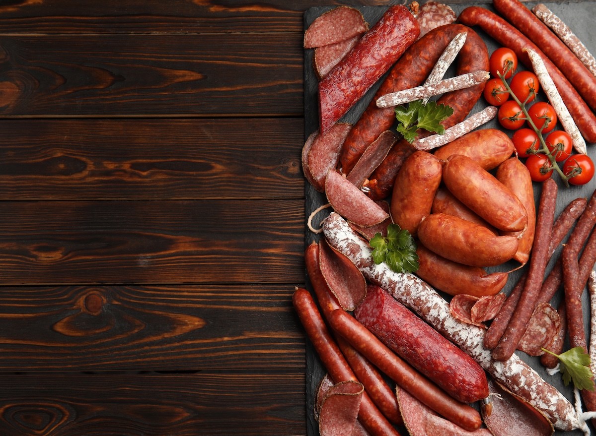 Different,Tasty,Sausages,On,Wooden,Table,,Top,View.,Space,For