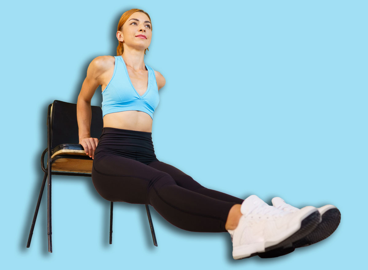 Healthy lifestyle, activity, fitness, sport. Woman doing reverse push ups using chair. Back and arms workout without equipment in gym