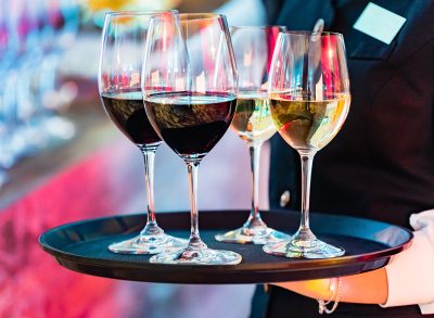 waiter with drinks, red and white wine