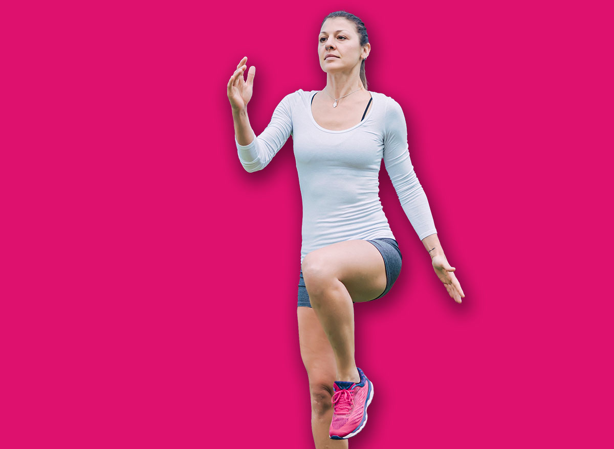 Athletic woman is training at an outdoor gym