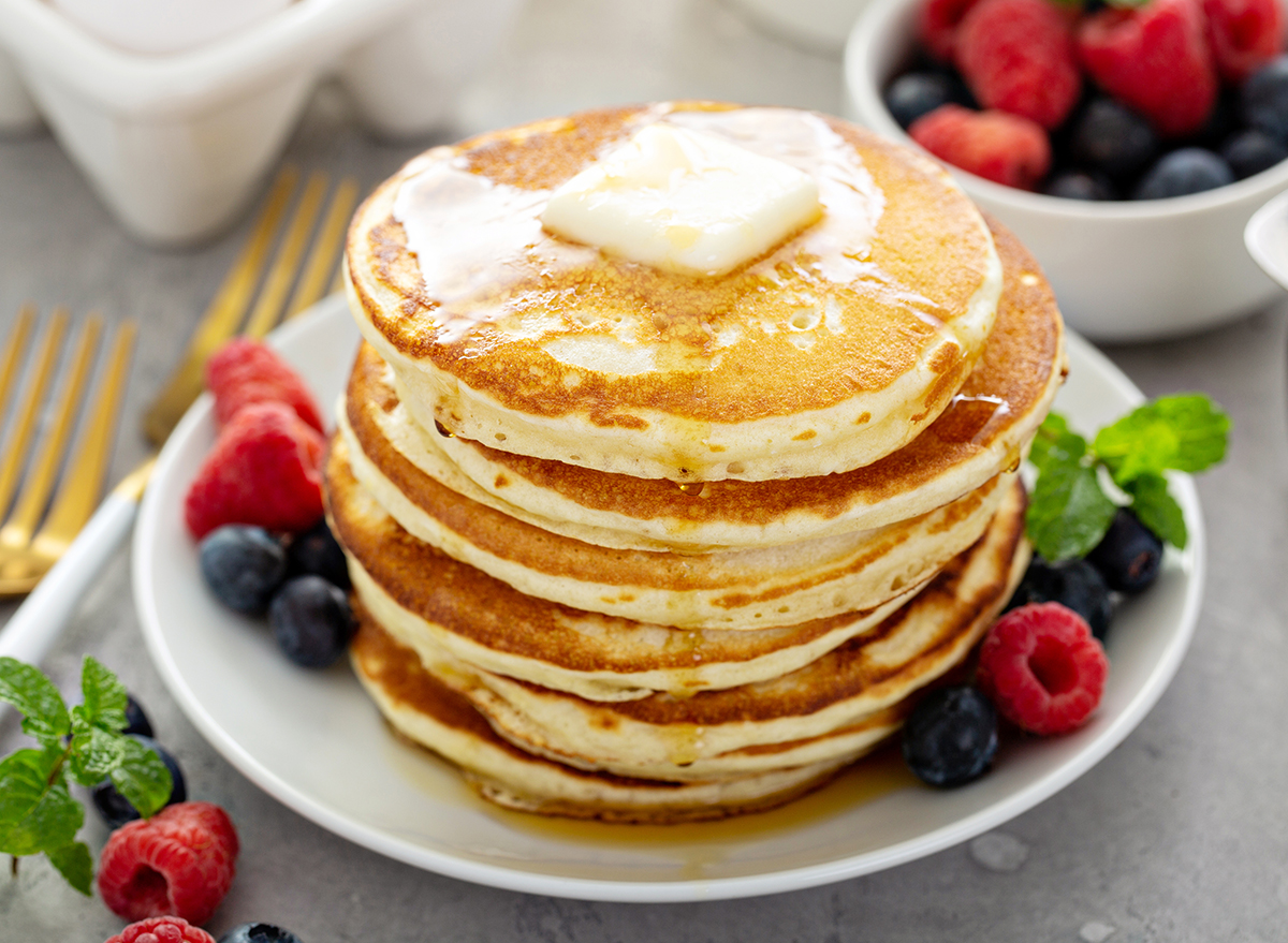 Fluffy buttermilk pancakes with butter and maple syrup