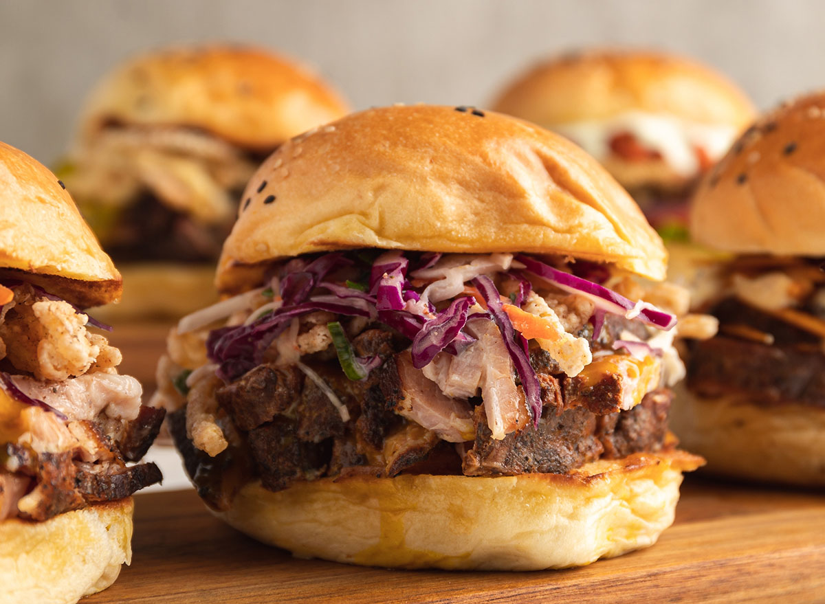 Bread with roast meat, brisket, lettuce, fresh cabbage and sauces.