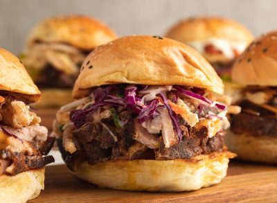 Bread with roast meat, brisket, lettuce, fresh cabbage and sauces.