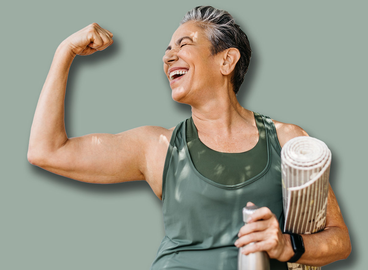 Happy elderly woman celebrating her fitness achievement after a great outdoor workout session, flaunting her strong bicep. Fit senior woman expressing her pride in her successful exercise routine.