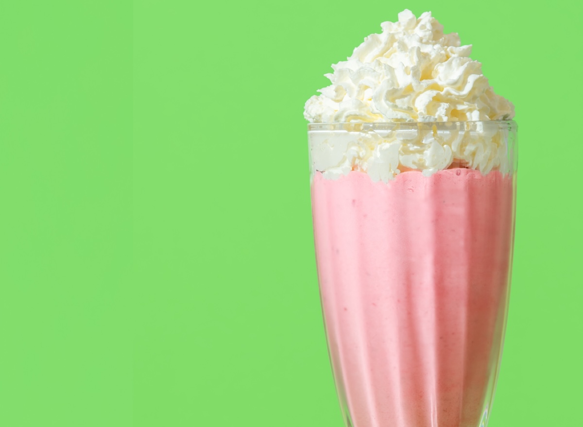 Close up,With,A,Glass,Of,Strawberries,Milkshake,Topped,With,Whipped