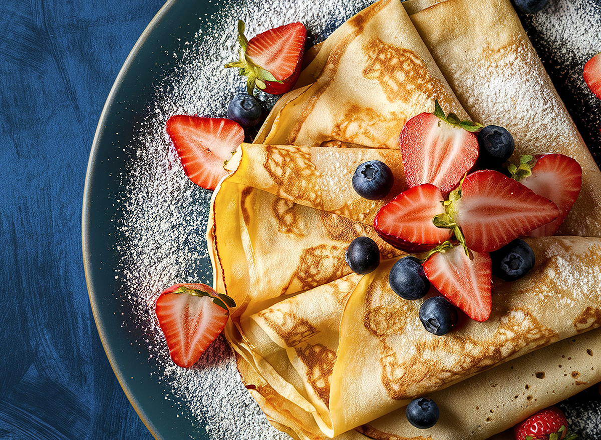 fresh homemade crepes artfully arranged on a plate