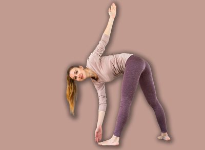 Rear view of woman and men doing windmill exercise during group fitness training in studio.