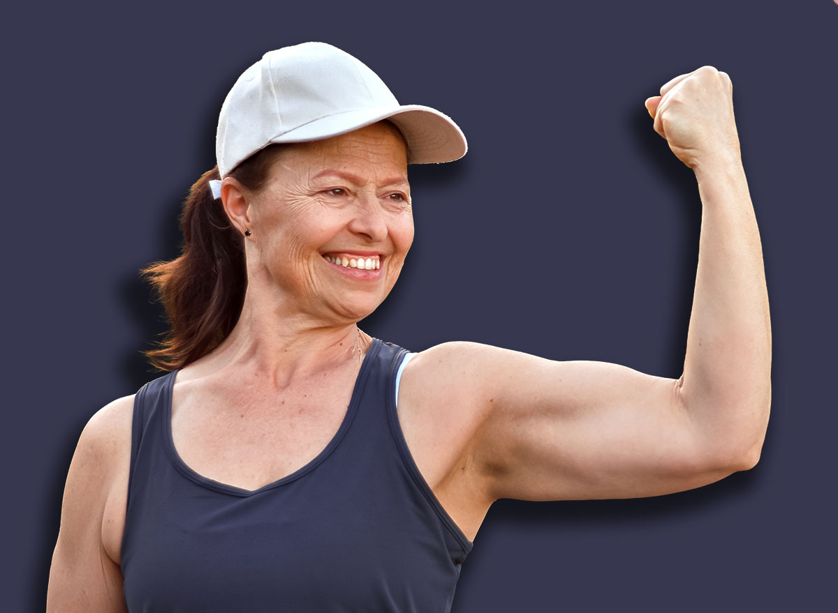 Female physical education teacher showing off her biceps and muscles, healthy lifestyle, body care