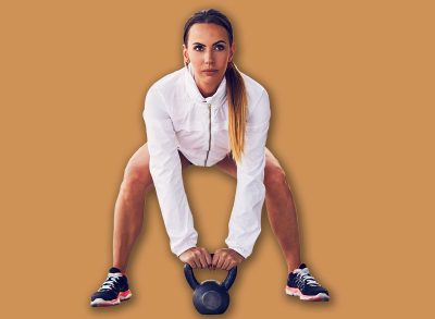 Woman before kettlebell swing cross fit exercise