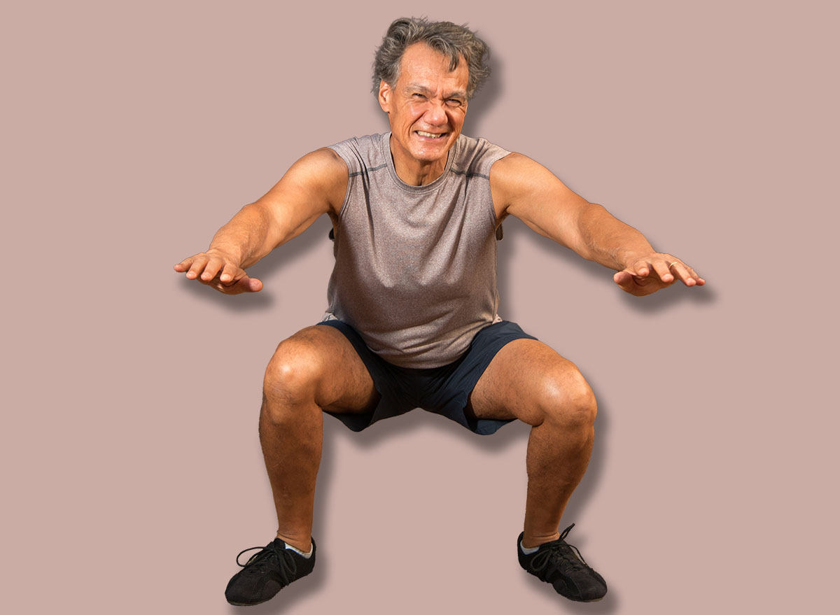 Mature Senior Man Exercising Doing Squats
