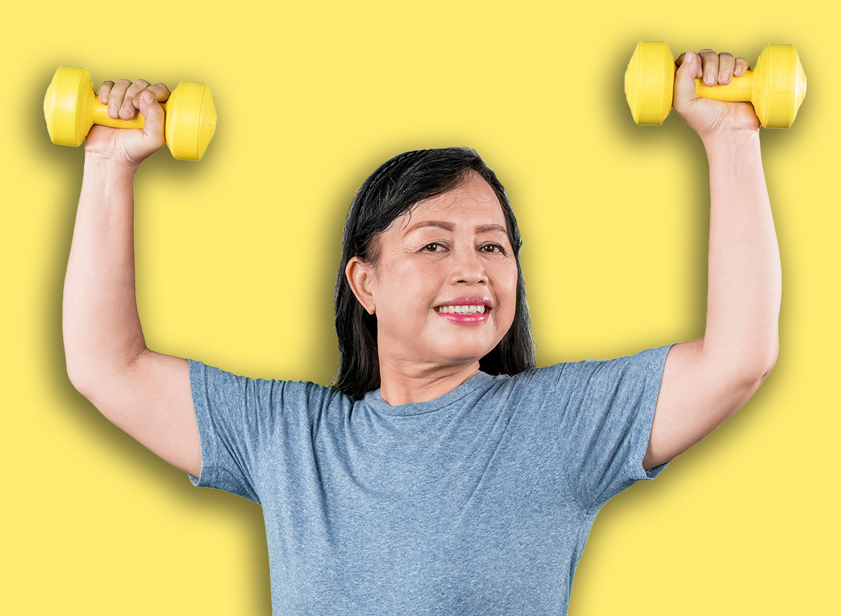 Happy Senior Woman Doing a Shoulder Press with Dumbbells