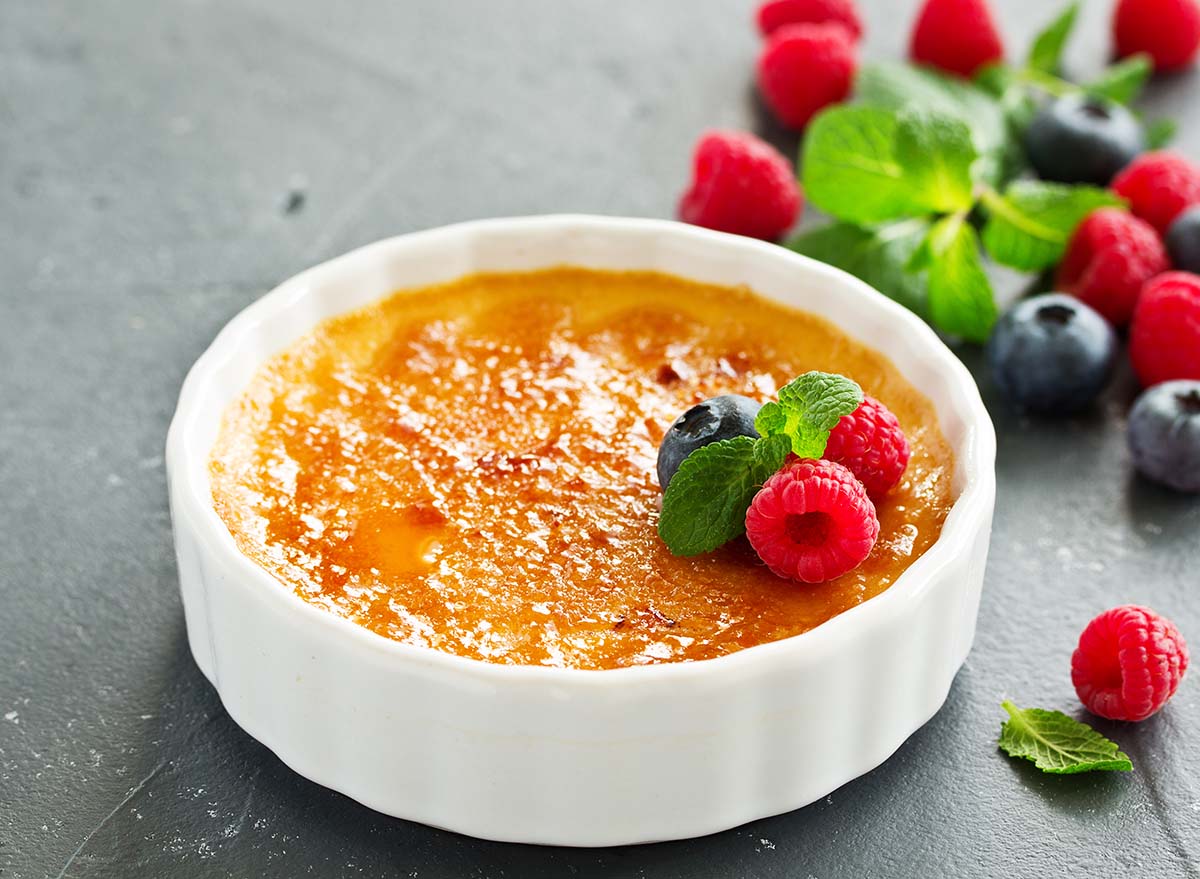 Creme brulee. dessert with caramel crust and berries.