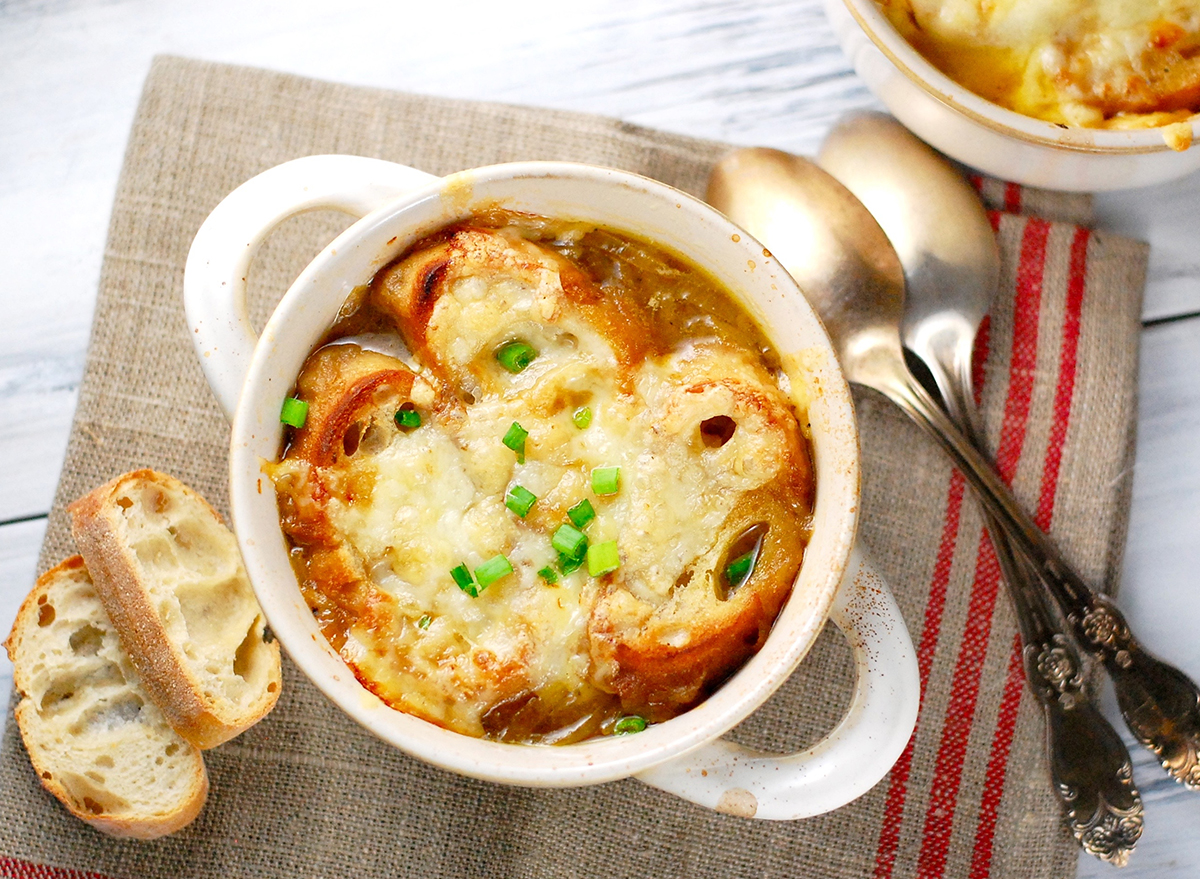 Traditional French onion soup with toasted baguette and melted cheese, dinner, supper, healthy homemade soup