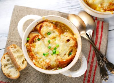 Traditional French onion soup with toasted baguette and melted cheese, dinner, supper, healthy homemade soup