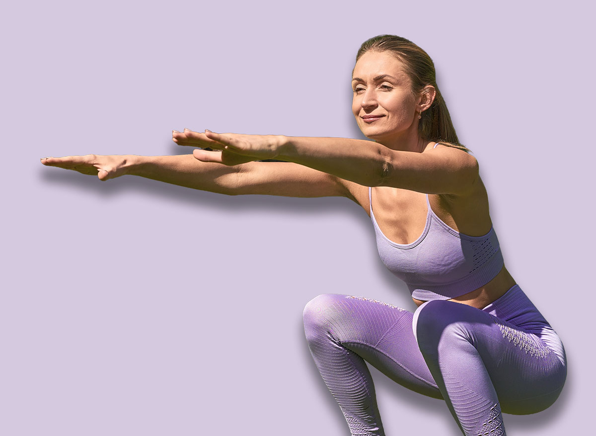 A woman, energized in sportswear, embraces strength training with parkside squats.