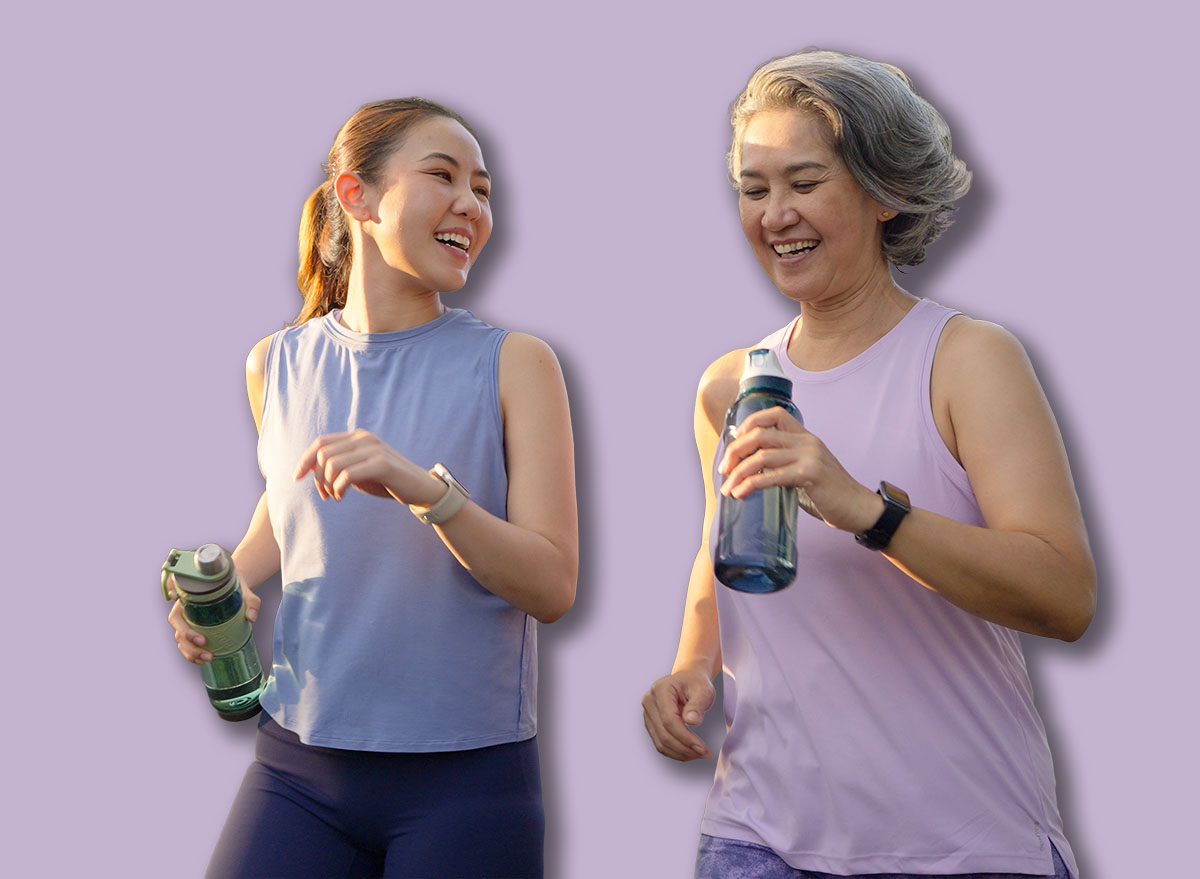 Young adult child workout outdoor public park run walk hold water bottle with mature middle age old mum. Love health care older mom asia elder people happy family protect aging fun joy city life sport