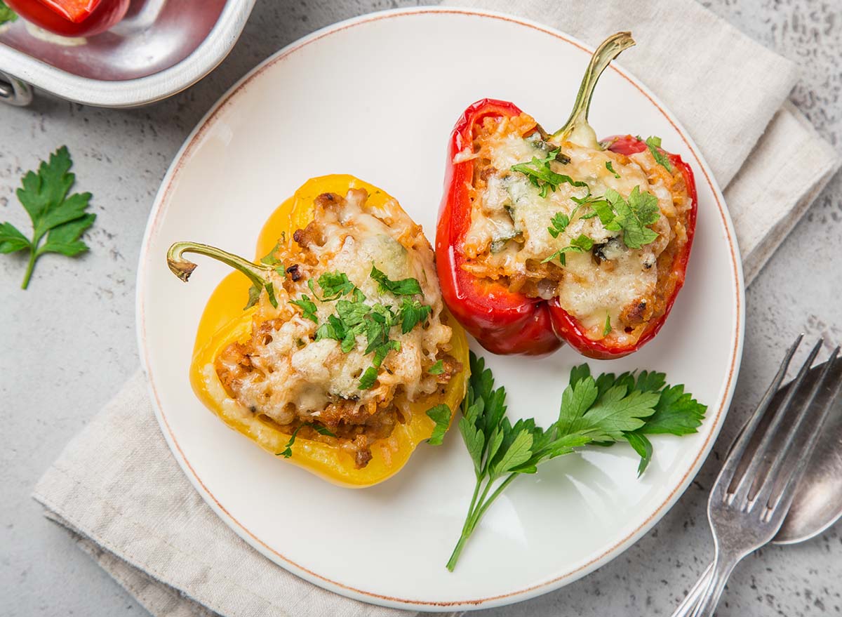 bell peppers stufed with meat, vegetables and cheese, top view