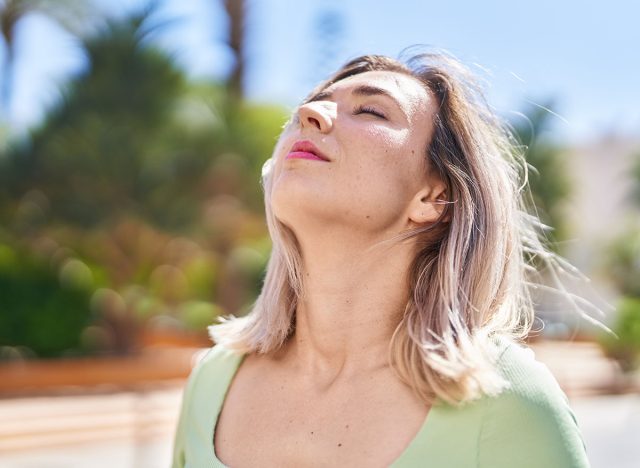 Neck Extensions Young woman breathing at park