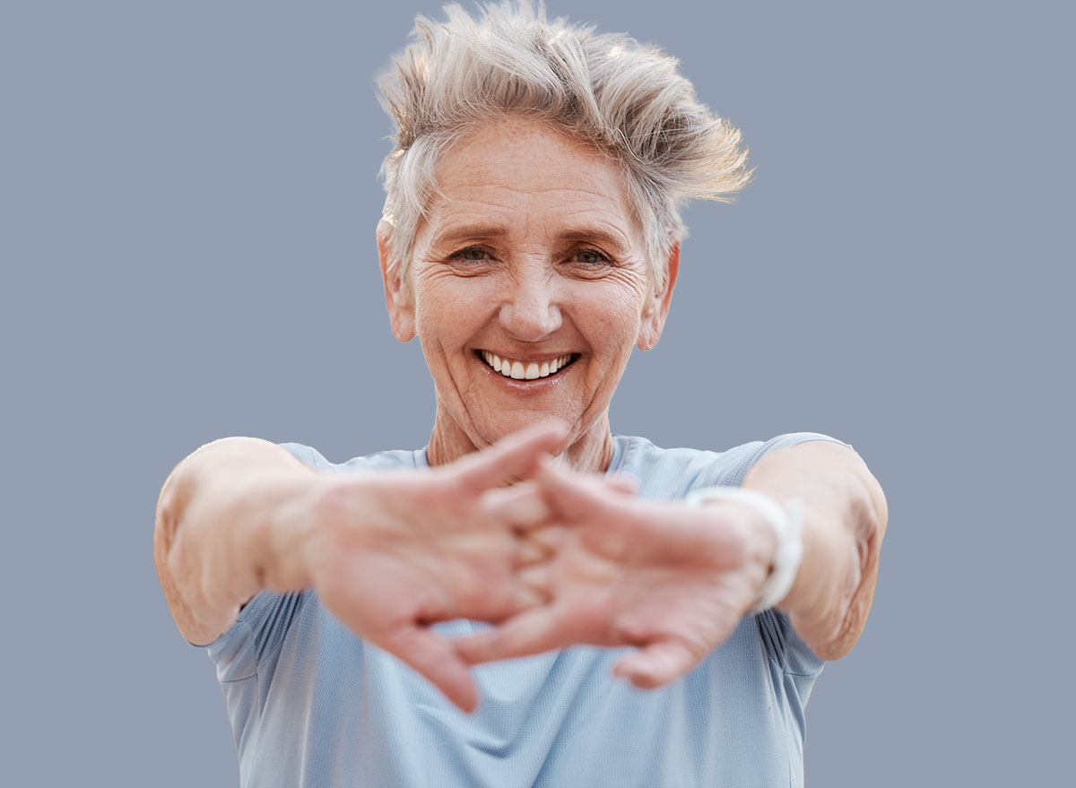 Portrait, senior woman and stretching hands, outdoor and exercise for retirement, health and fitness. Elderly female, mature lady and workout for training, healthy lifestyle and smile for wellness.