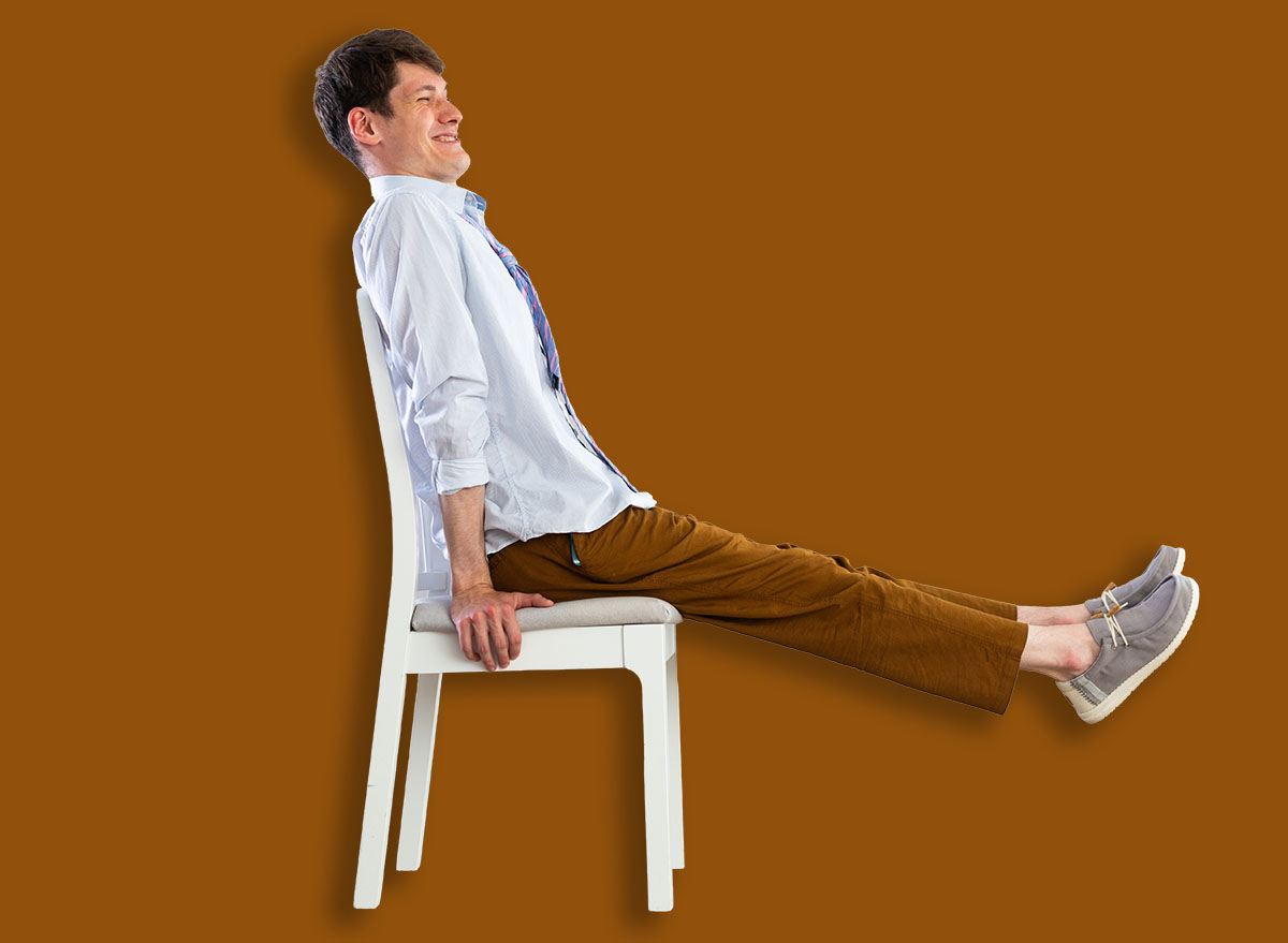 Young guy office worker doing exercises on