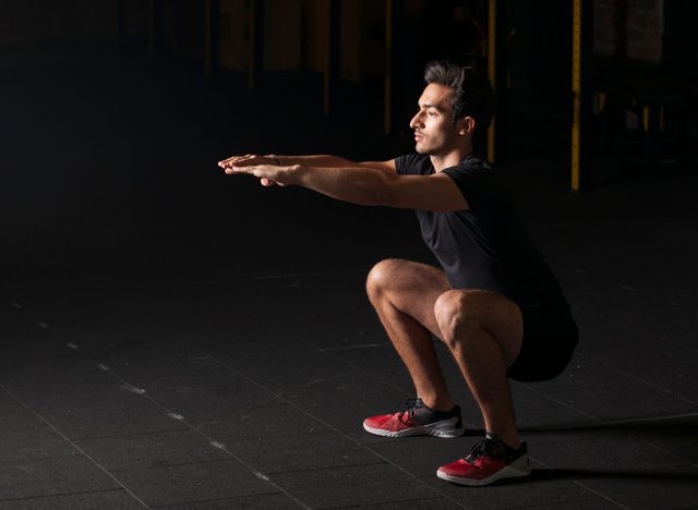 Athlete practicing some air squats