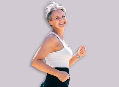 Happy Fit Senior Woman Jogging Outdoors in Sportswear, Smiling and Embracing Active Life