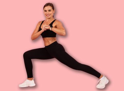 Portrait Of Young Athletic Woman Training Over Pink Background In Studio, Sporty Smiling Lady In Activewear Making Lunges And Core Rotation Exercise, Enjoying Fitness Workout, Copy Space