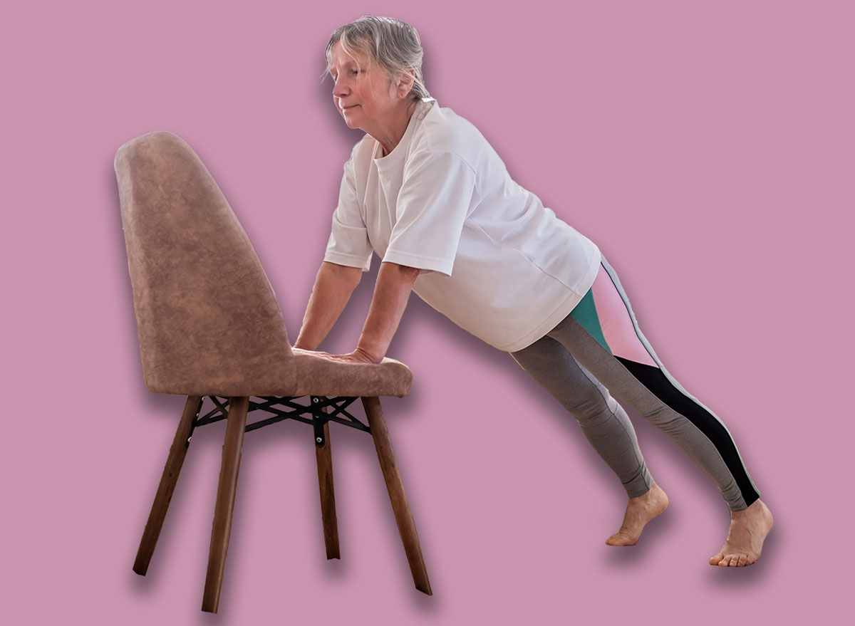 Senior caucasian woman doing yoga at home on chair