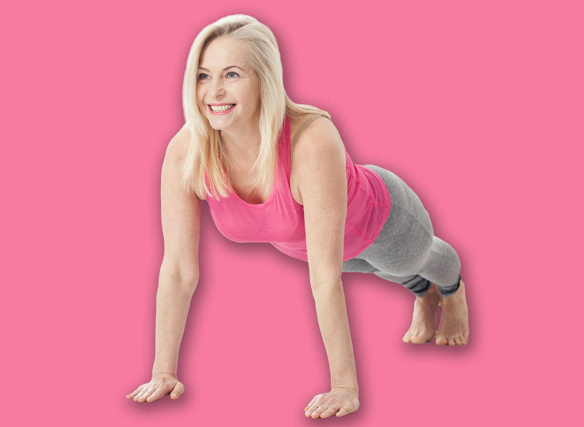 Happy woman in her 50s stretching for exercise. Joy of life and freedom in movement, concept. Selective focus.