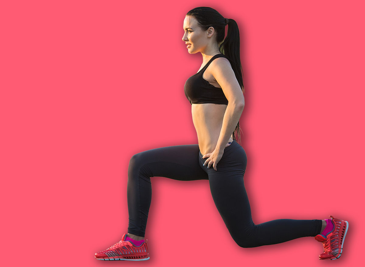 squatting.young beauty girl do exercises at the stadium