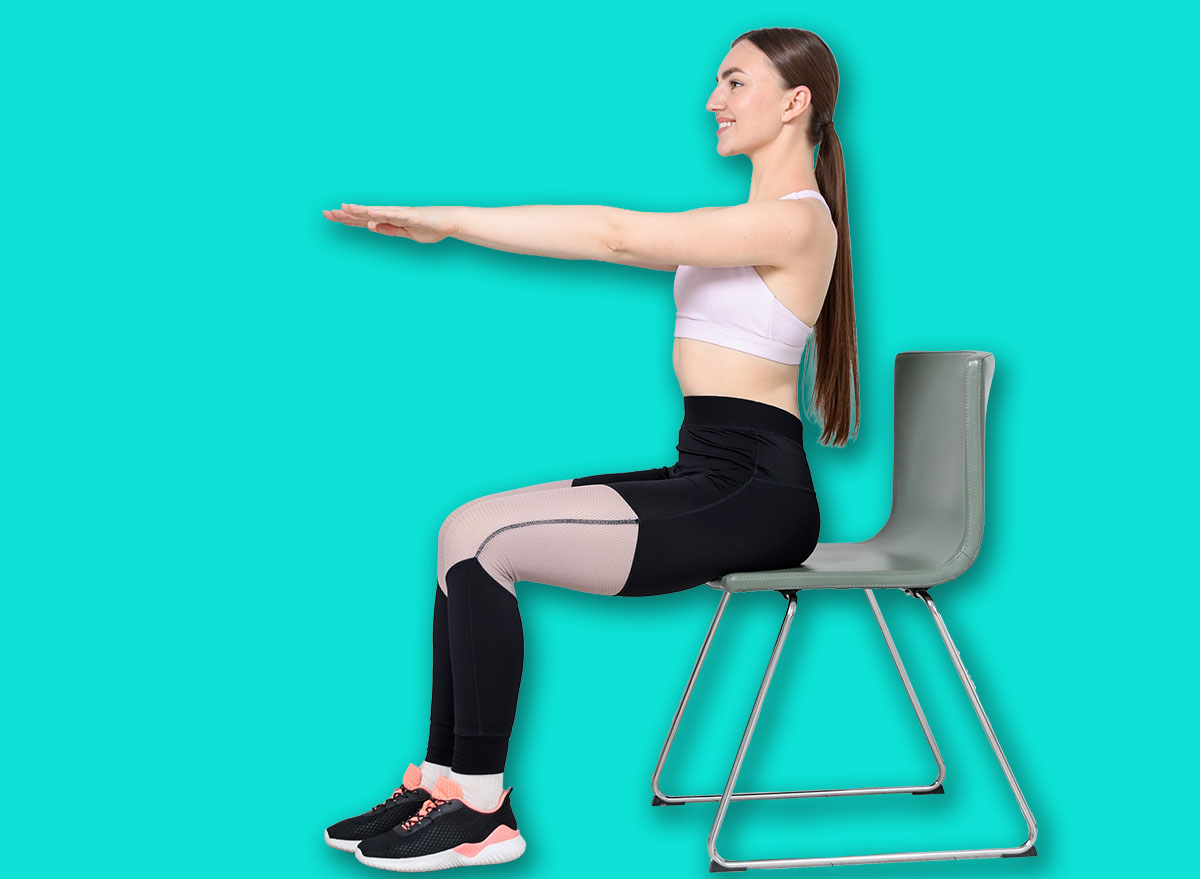 Beautiful woman stretching on chair at home